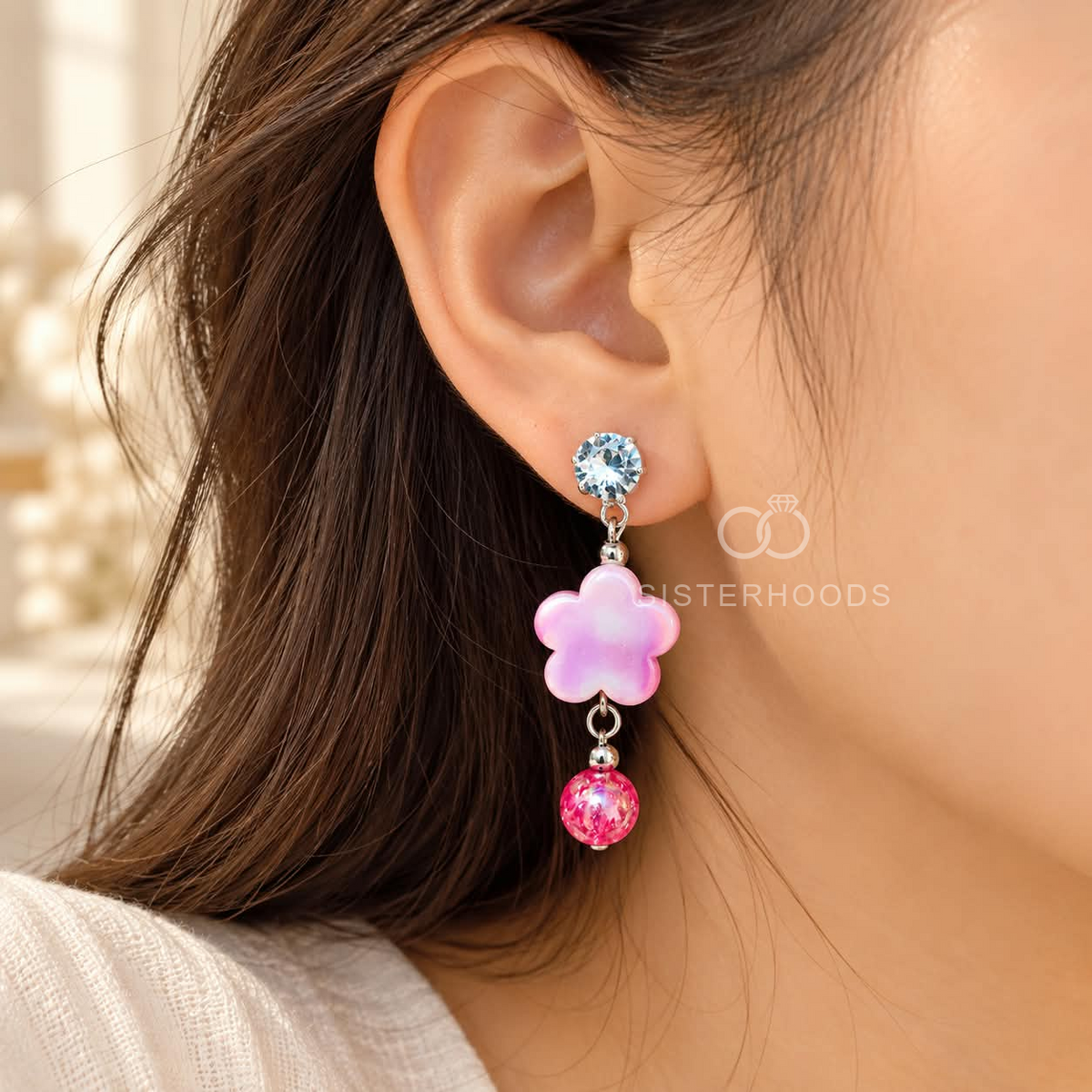 Pink floral dangle earring with a sparkling round accent and faceted pink bead | SISTERHOODS-SHA256:f0967d5d028686a490802ddd9b07a9521a0077cc02df6f9c19c251e533f4a6d7