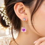 Silver-tone dangle earring with a clear round accent, slim bar and soft purple square drop. | SISTERHOODS-SHA256:ab6929a9bde40caf5926b226666052e3123feb07a4ae2cd1cd9845ea7e9db342