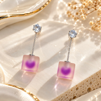 Silver-tone dangle earring with a clear round accent, slim bar and soft purple square drop. | SISTERHOODS-SHA256:95c055dd527553cbc4ce43ef2f740ec95a543ea28d1c61c9b1d93d312a6bf715