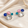 Multicolour geometric stud earrings with blue, pink, turquoise and clear faceted accents | SISTERHOODS-SHA256:ed8d2db608ac1e99dded24cb3fcb267509b294bcef4913d0b80aca82115af963