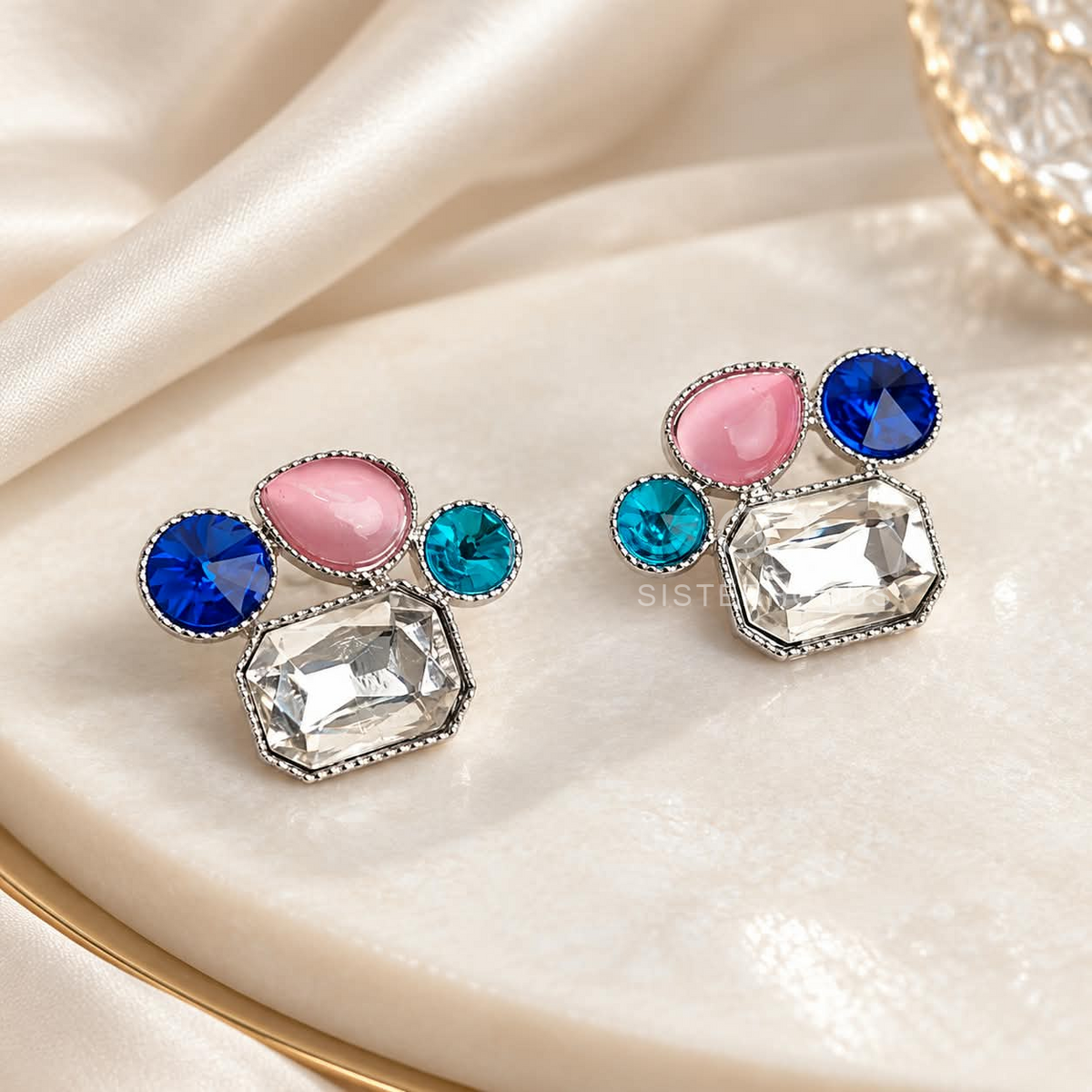 Multicolour geometric stud earrings with blue, pink, turquoise and clear faceted accents | SISTERHOODS-SHA256:ed8d2db608ac1e99dded24cb3fcb267509b294bcef4913d0b80aca82115af963