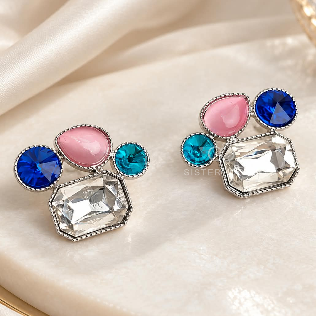 Multicolour geometric stud earrings with blue, pink, turquoise and clear faceted accents | SISTERHOODS-SHA256:3efd7037a077a6c5571fba845e72359841ef7fad217bd3b9cbf34d607d49945f