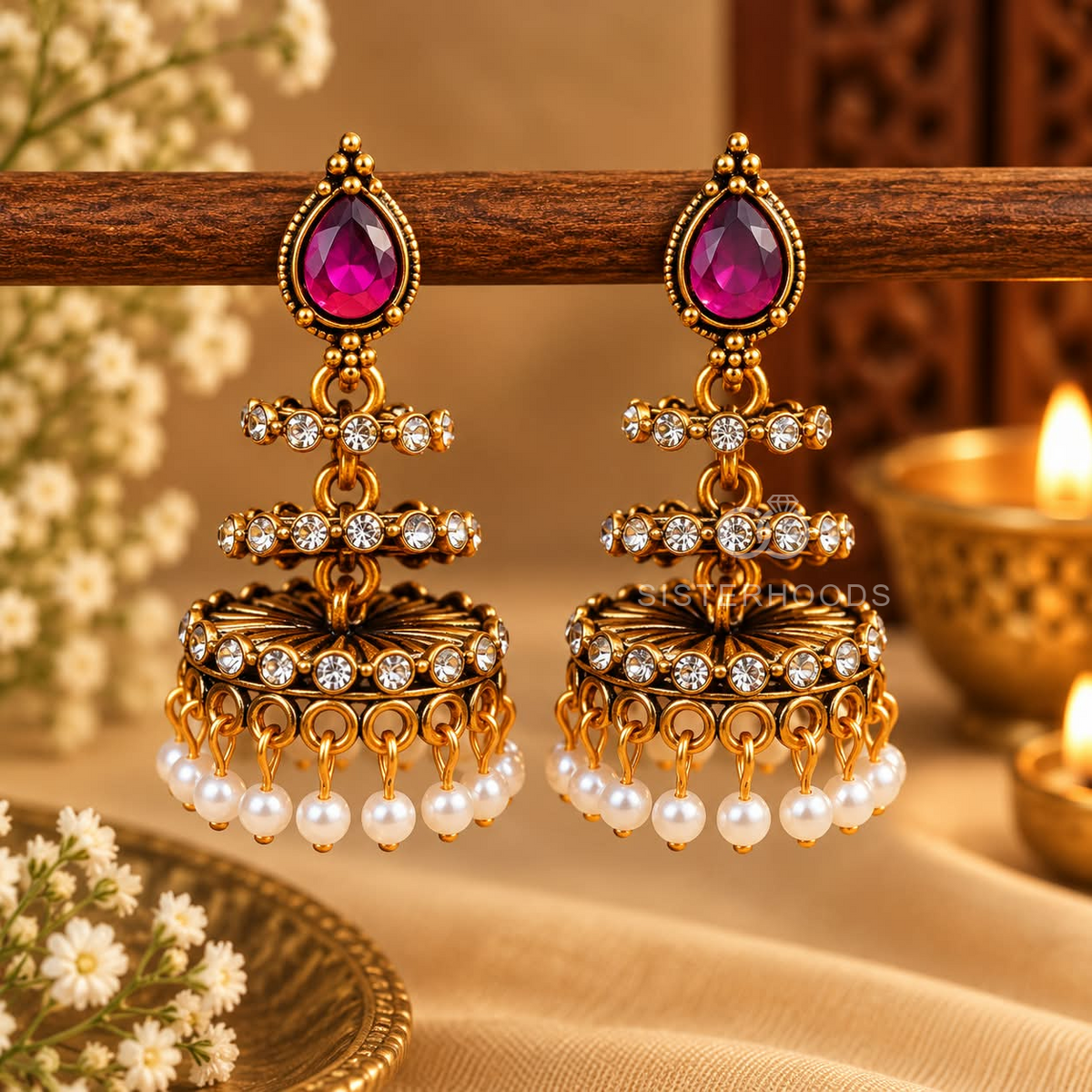 Gold-tone traditional jhumka earring with pink teardrop accent, clear stone details and white pearl fringe | SISTERHOODS-SHA256:d122f89a606509994050372a303ed8252ee04213fb23bd72de8e0a31b53a3c4a