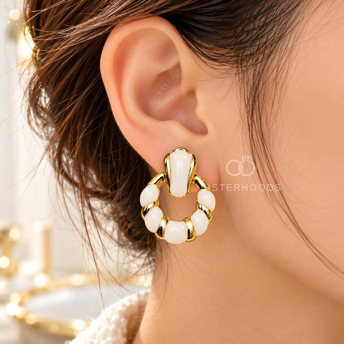 Gold-tone Korean dangle earrings with circular white accents on a model's ear. | SISTERHOODS-SHA256:cc8b8985d67d9955d6f81bbb41bd96f3fff865e3d8df4199a8aeac0e00962327
