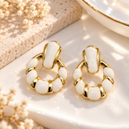 Gold-tone Korean dangle earrings with circular white accents on a model's ear. | SISTERHOODS-SHA256:fd454a1b78242ddf297eae05a488668d8200c50cc5f999cd61af1b705afda528