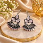 Oxidized silver jhumka earrings with pink floral accents and detailed bell-shaped drops | SISTERHOODS-SHA256:7f61958511e73d075977bcbefa34587c3ee47ec5dc6edb0d7a53628f78eb780c