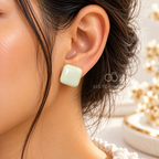 Pair of pale green rounded square stud earrings | SISTERHOODS-SHA256:a554f507acfc7c3d4f2c68a5b9afc1e11f9646589e70344e5d4d45021dc001ff