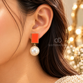 Red rectangular earrings with large white pearl drops | SISTERHOODS-SHA256:01ec1d08591dfadfae526f73337ecdc72fa2e2253115f28af66e1601fad9b1bc
