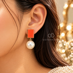 Red rectangular earrings with large white pearl drops | SISTERHOODS-SHA256:01ec1d08591dfadfae526f73337ecdc72fa2e2253115f28af66e1601fad9b1bc