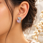 Pink faceted heart stud earrings with textured silver-tone detailing | SISTERHOODS-SHA256:0e9cab51325c1ab96fe7be6ee8d297a3cf66449dda2ee9c8aefea952df062114