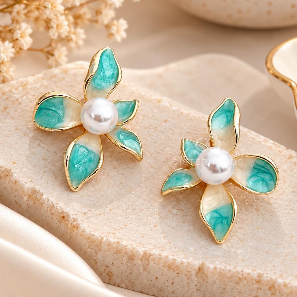 Turquoise petal-shaped flower stud earrings with white pearl-look centres and golden outlines | SISTERHOODS-SHA256:628b398f5e1be11bfe9fffbfeb0baa43cde555855c290d371c79ad1422b3dbad
