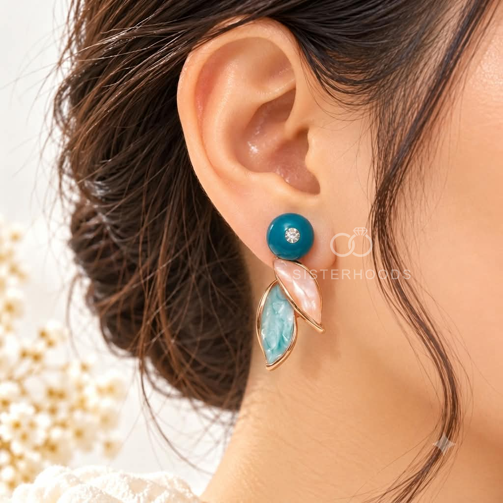 Multicolour dangle earrings with teal, pink and aqua leaf-shaped accents | SISTERHOODS-SHA256:9940e187b3eca1bedc68cc649152c0131a615cfe62130fb10f9363f5f3ba7212