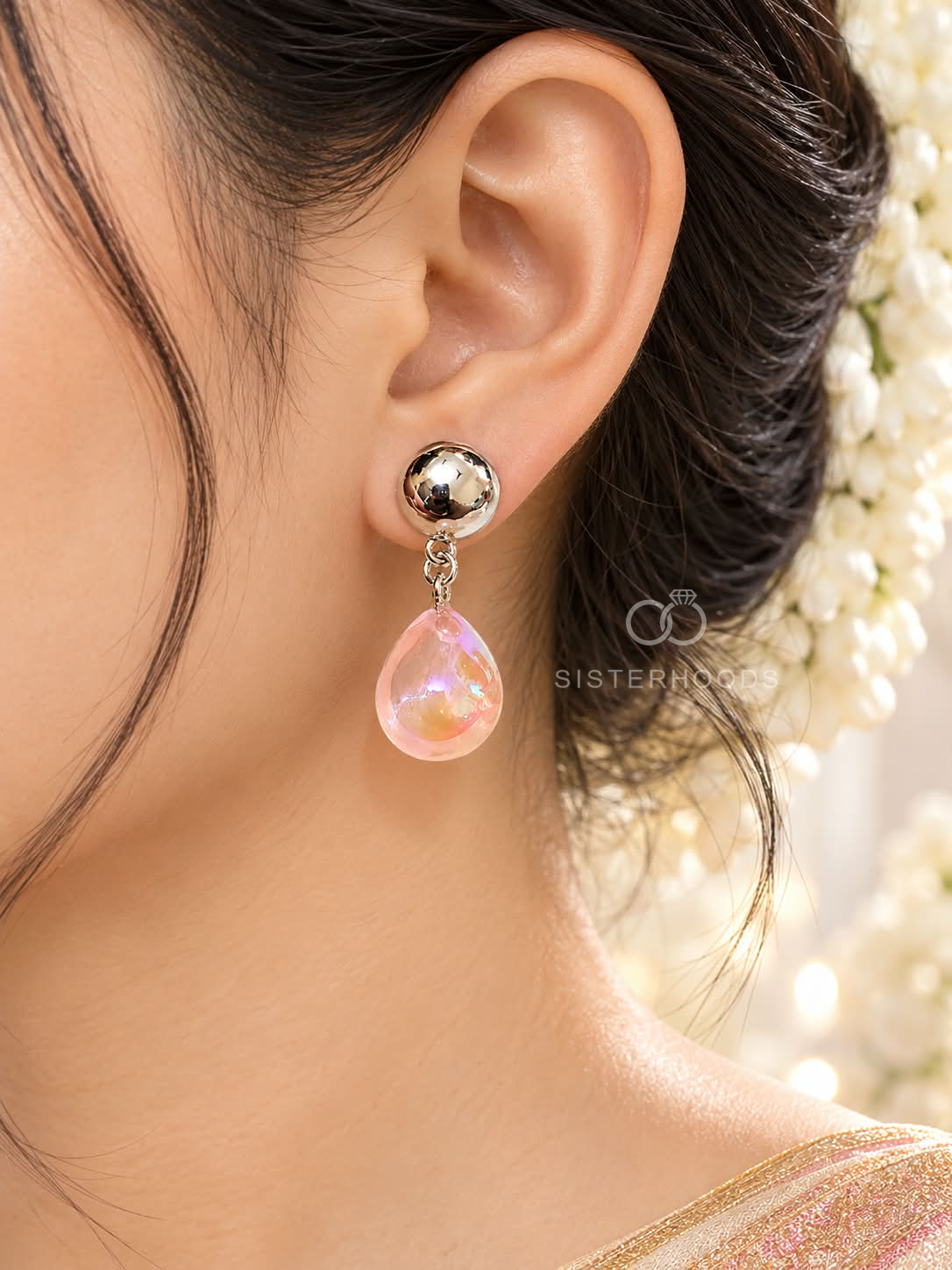 Silver-tone stud earrings with pink iridescent teardrop accents | SISTERHOODS-SHA256:47fc9ce0a428553ca4409af07527fecbb2db1e79b8f22303c66f82c072acd7c2