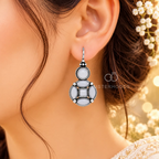 Silver-tone geometric dangle earring with white accents and circular, oval and square detailing | SISTERHOODS-SHA256:df2524b7908e051a547717d6c92478e18aae990e6c6bf7064c41b1952748251f