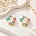 Multicolour pearl stud earrings with turquoise shells, purple starfish and sparkling accents | SISTERHOODS-SHA256:995c33602fa9f6e6f7142bab67707ef5b642d4e7160585e2f526eb446ec251d2