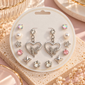 Mixed silver-tone earring set with heart, butterfly, pearl, floral, star and colourful faceted designs | SISTERHOODS-SHA256:a89effbc36242fac5654197fbf86f6e261092c9ac10b283a21f13b1a286aa1f9