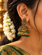Ornate oxidized jhumka earrings with goddess motifs and green bead drops | SISTERHOODS-SHA256:ac19a8e887778d2452bb7b311e948e4cdf7287b702afdea38a96117ff59f16bc