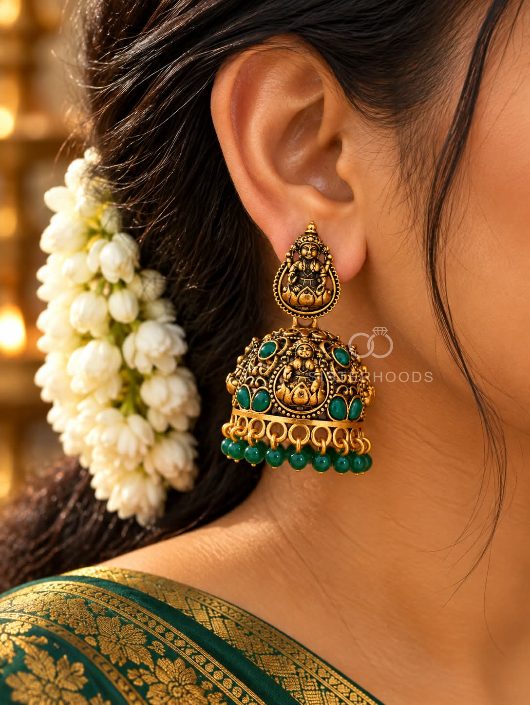 Ornate oxidized jhumka earrings with goddess motifs and green bead drops | SISTERHOODS-SHA256:ac19a8e887778d2452bb7b311e948e4cdf7287b702afdea38a96117ff59f16bc