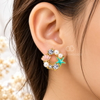 Multicolour pearl shell and starfish stud earrings with sparkling accents | SISTERHOODS-SHA256:92aae8b8d34d313630287753e84174306fe60ee72a28a68374d93b9074fd0c66