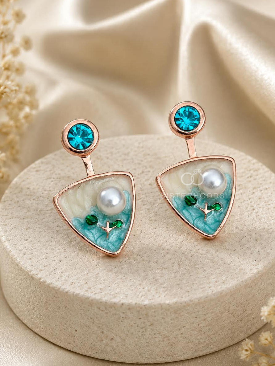 Turquoise triangular drop earrings with blue studs, white centre details and botanical accents | SISTERHOODS-SHA256:2dabe9dcbc0322f17a0b115000209581761212de4c99a4adf60e728ece754d2f