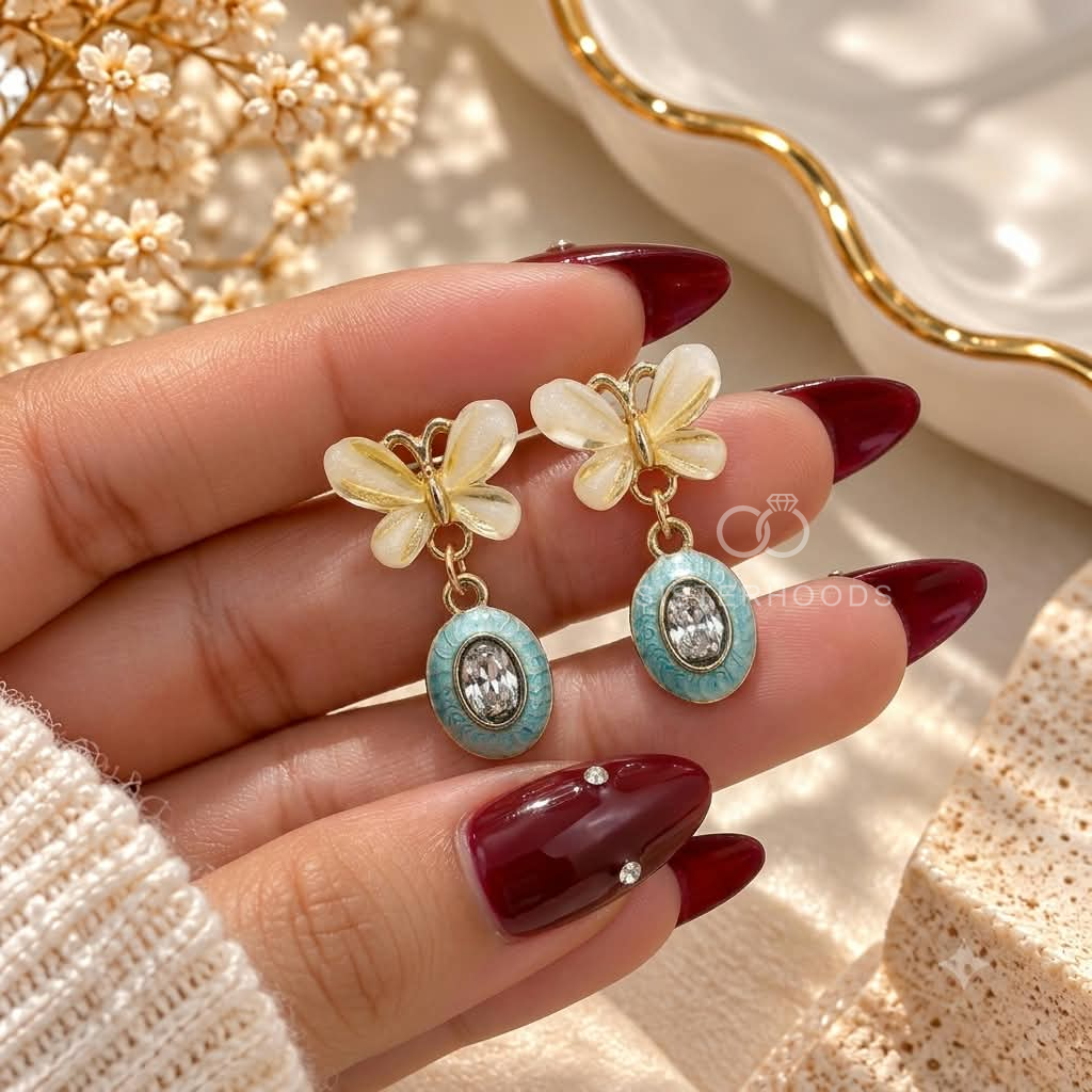 White floral drop earrings with turquoise oval accents and clear centre details | SISTERHOODS-SHA256:19f7c6efafaf3f64416c73cba0fd1ec7dacc9bfc5d3818aa29be839e009ebb54