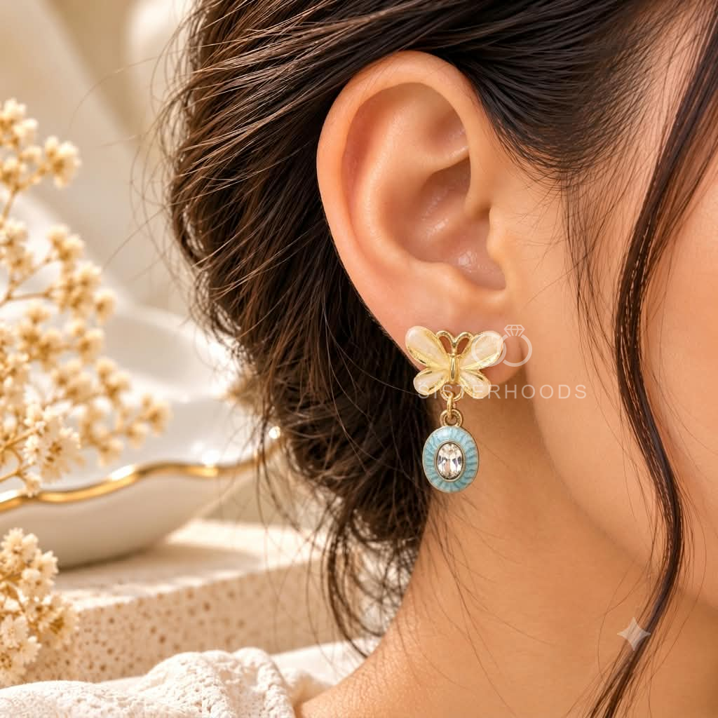White floral drop earrings with turquoise oval accents and clear centre details | SISTERHOODS-SHA256:73ea84df2082c82c474cdb22b59e1f20faab56346f0f896019fe3e0e59514fc2