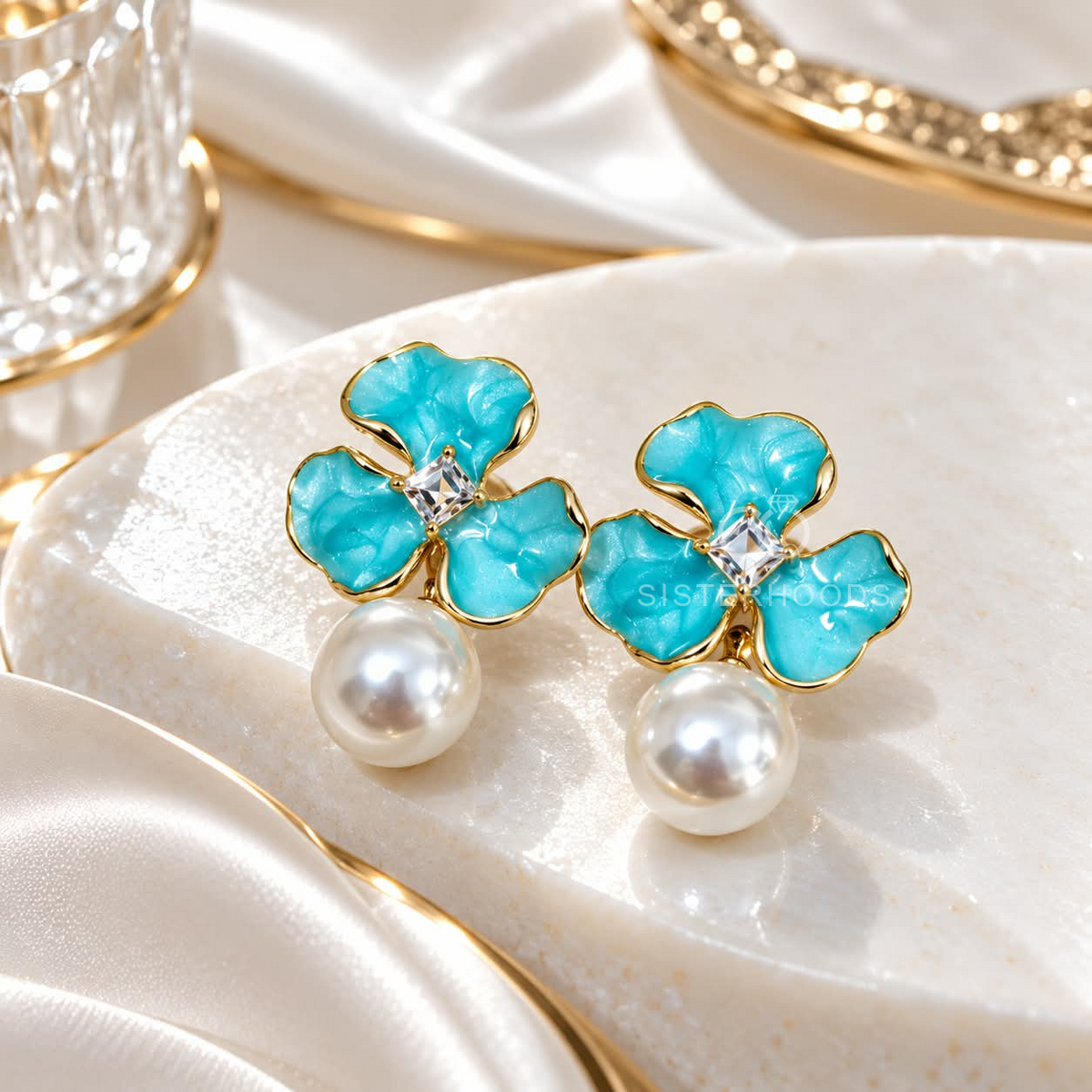 Turquoise floral drop earrings with clear centre accents and white pearl pendants | SISTERHOODS-SHA256:358fd55fe0b8ede1419251cb96d47f7666316e27228ff28d25925e4fa7b25570