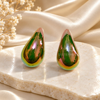 Glossy green teardrop stud earring worn on an ear | SISTERHOODS-SHA256:665c1e17503b5021ca17902f737b08dd7d3c82061c3915a5f335c668094f8706