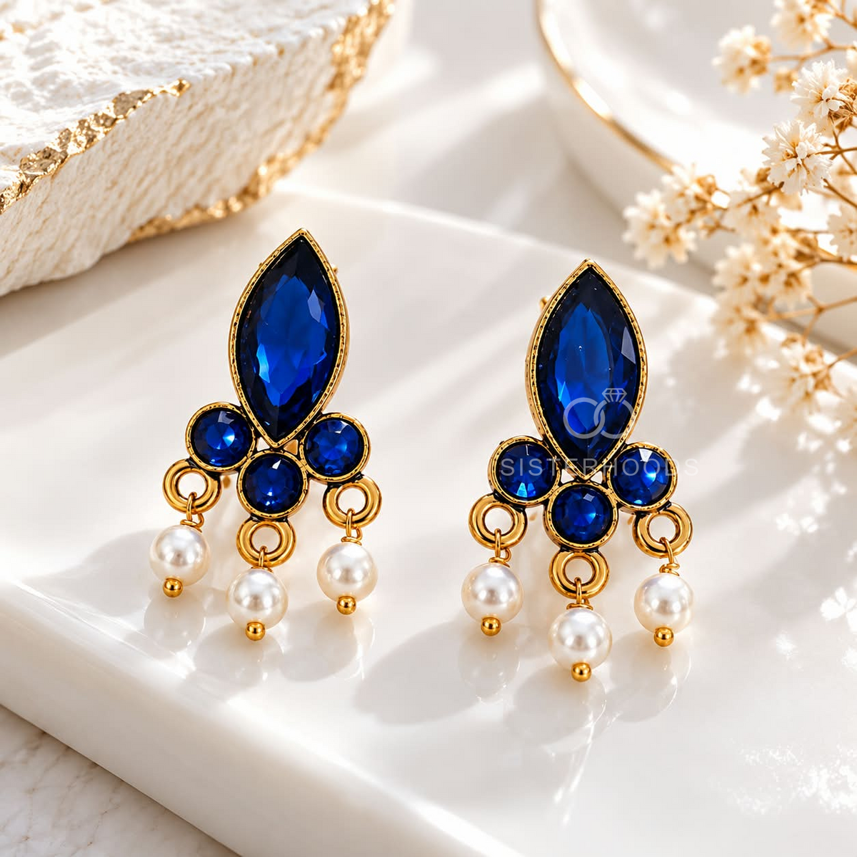 Blue floral dangle earring with white bead accents and gold-tone detailing | SISTERHOODS-SHA256:562508b18a0d859c75a72cf40b470e88cb2870d5de3911874b10ded1ed3de274