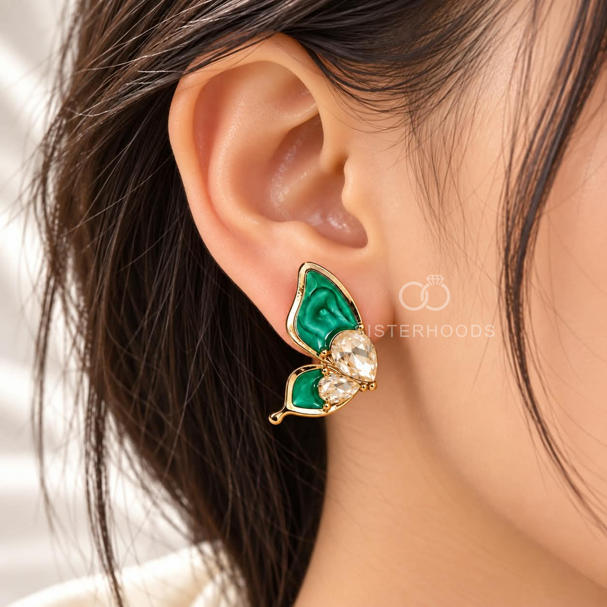 Green butterfly stud earrings with faceted clear accents and gold-colour detailing | SISTERHOODS-SHA256:b8819da8768b2f6010de552729f586f3a28bbaa50db014b7fb6cd9ac4071daa5