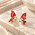 Red wing-shaped stud earrings with clear faceted accents | SISTERHOODS-SHA256:105205e7dededa672e275a1f6af287ff279a1c1ebae580b5f57ef652fc5314f0